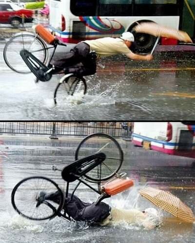 Biking With Umbrella In The Rain